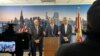 El senador Rick Scott (en el podio) junto a los congresistas Mario Díaz-Balart (derecha) y Carlos A. Giménez (izquierda) en el Aeropuerto Internacional de Miami, el 24 de mayo de 2024. (OCB Image).