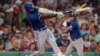 Adolis García, de los Texas Rangers, conecta un jonrón en juego contra los Boston Red Sox, el 5 de julio de 2023. (AP/Steven Senne)