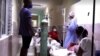 Enfermos de COVID-19 en los pasillos del hospital de Cárdenas. (Captura de video/Reuters)