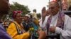 El cardenal Juan de la Caridad García bendice a peregrinos en El Rincon, Cuba, el 16 de diciembre de 2023. ( AP Photo/Ismael Francisco).
